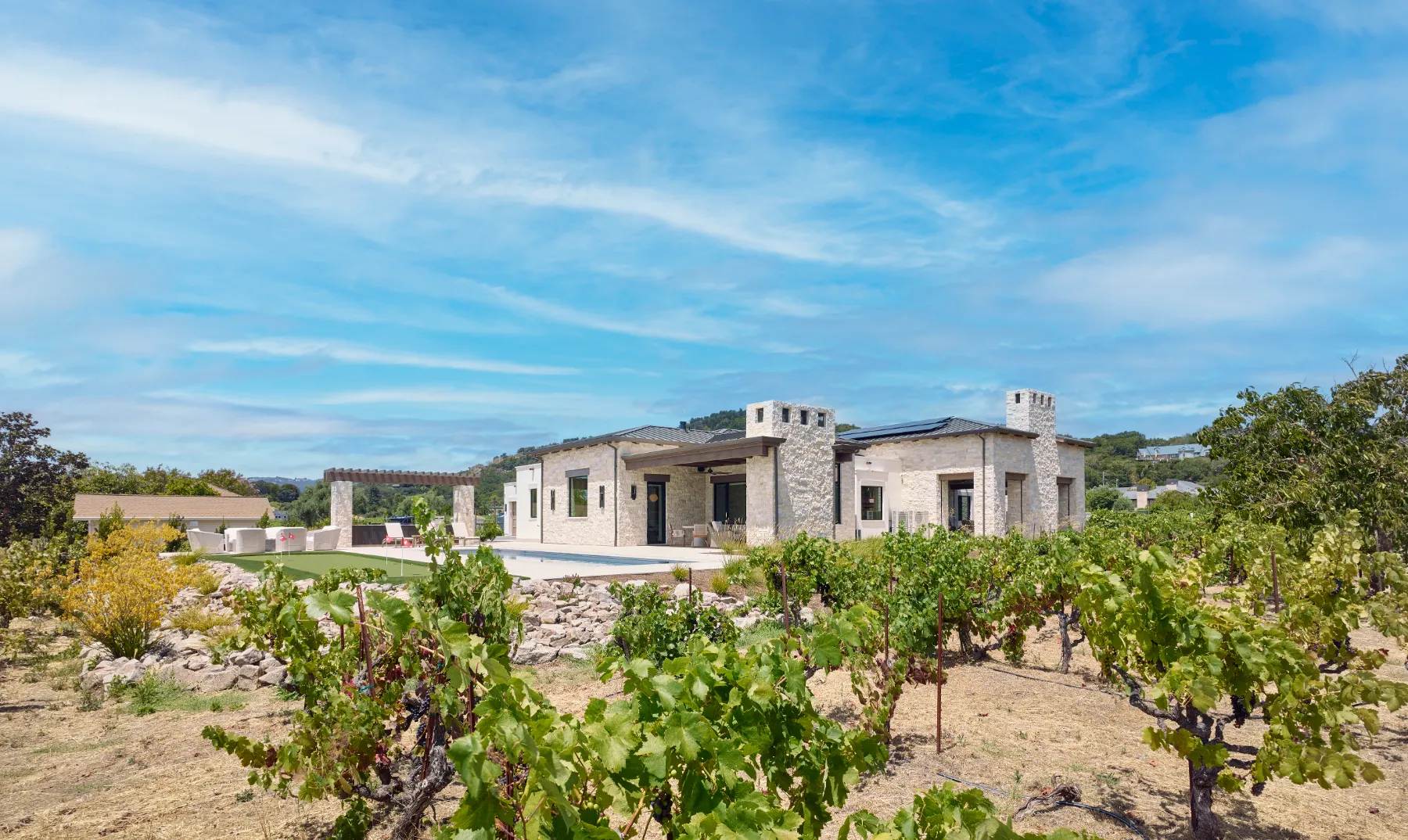 Hillside house above the vines at golden hour
