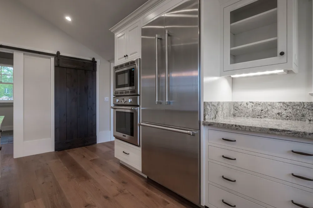 Renovated interior with a butler's pantry and warm timber cabinetry