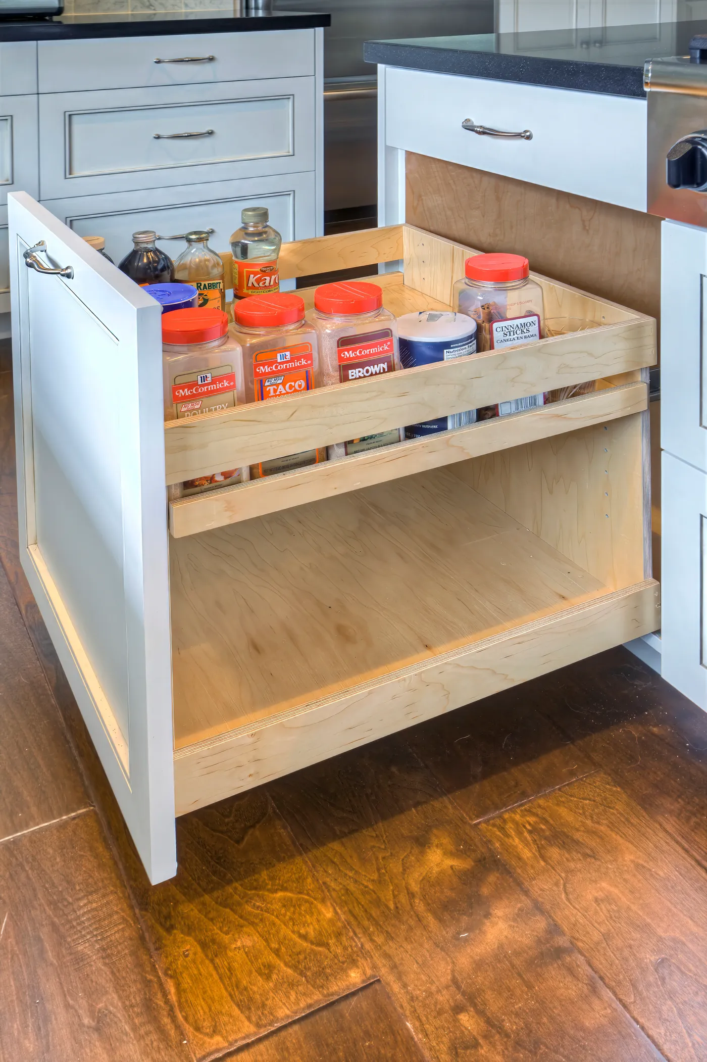 Pull-out pantry drawer fitted in maple, pulled fully open